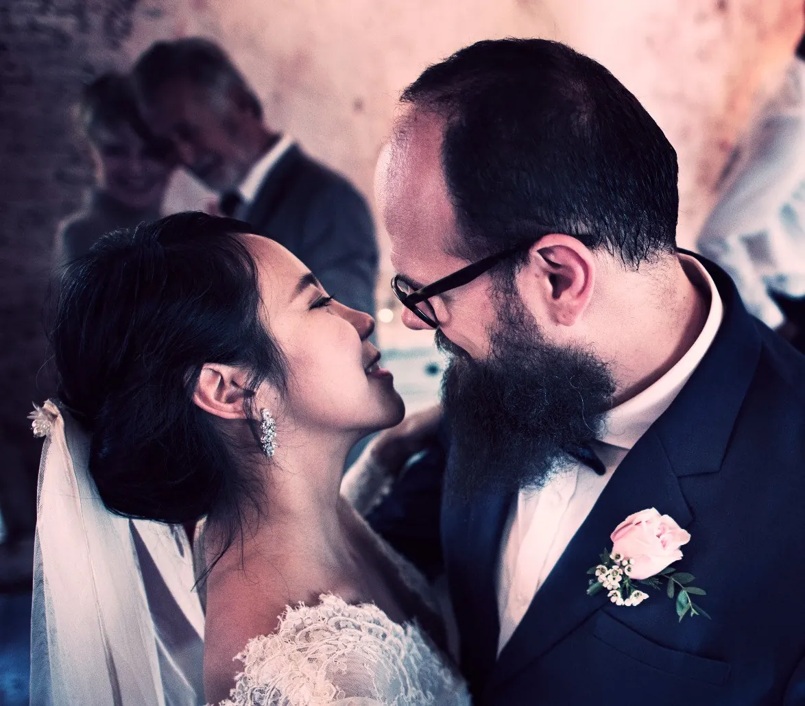 Bride and groom sharing their first dance in the middle of the dance floor